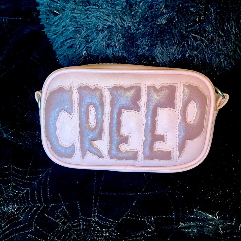 Love pain and stitches creep crossbody